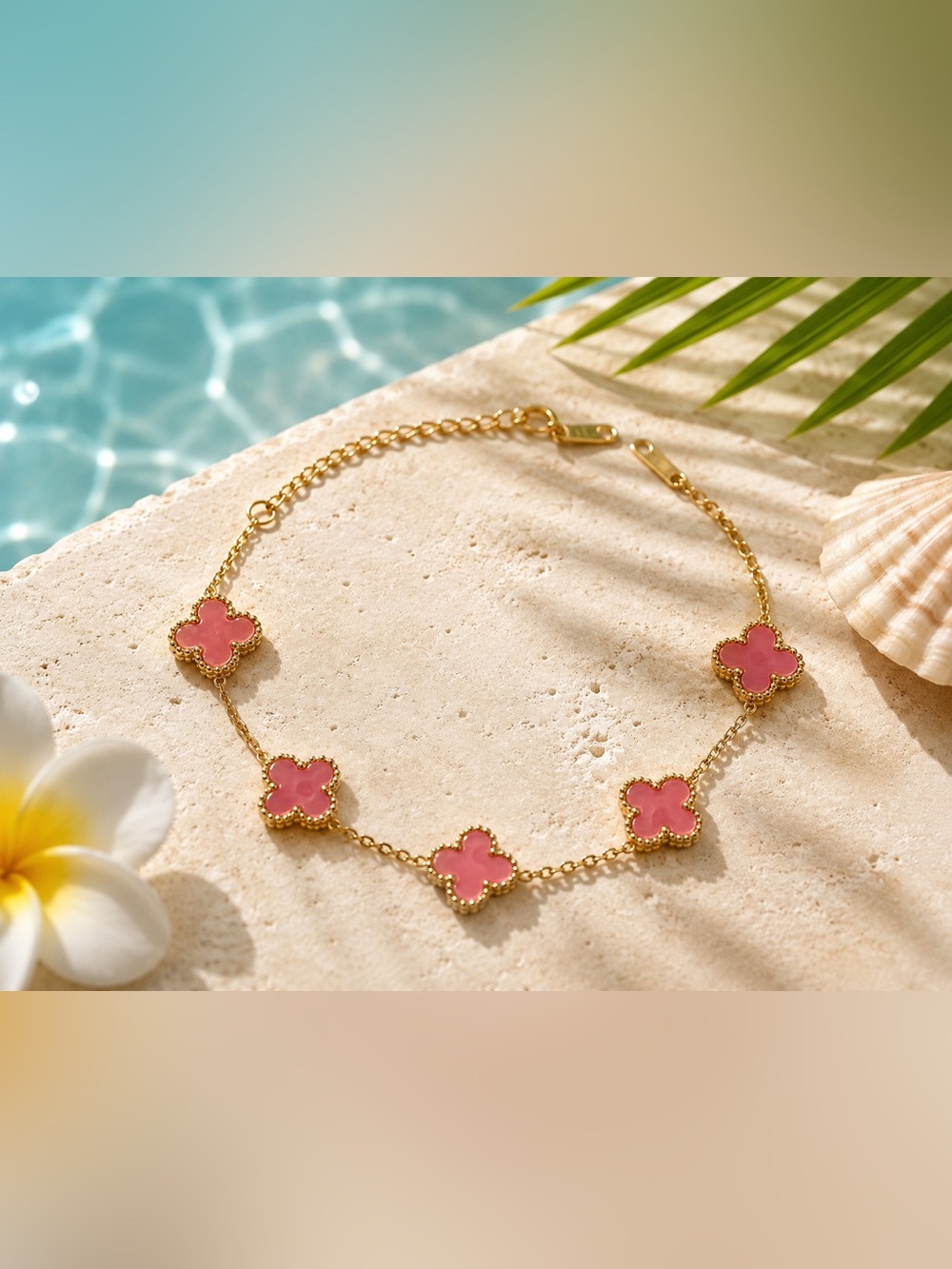 Gold-Tone Bracelet with Pink Clover Accents